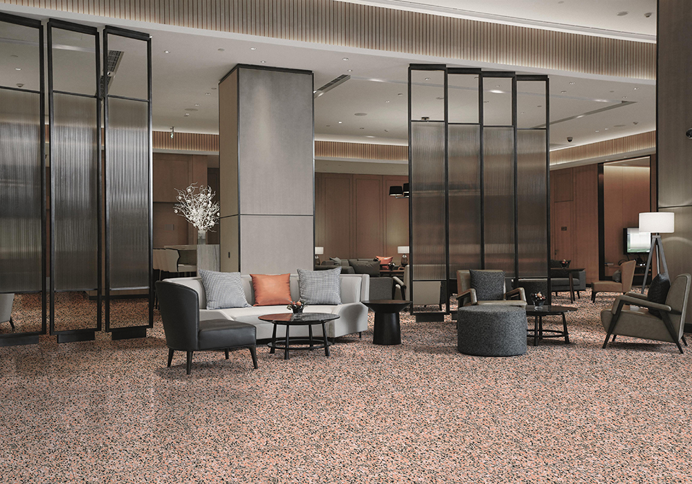 Hotel lobby interior with reception desk, sofas, marble floor and long bar.